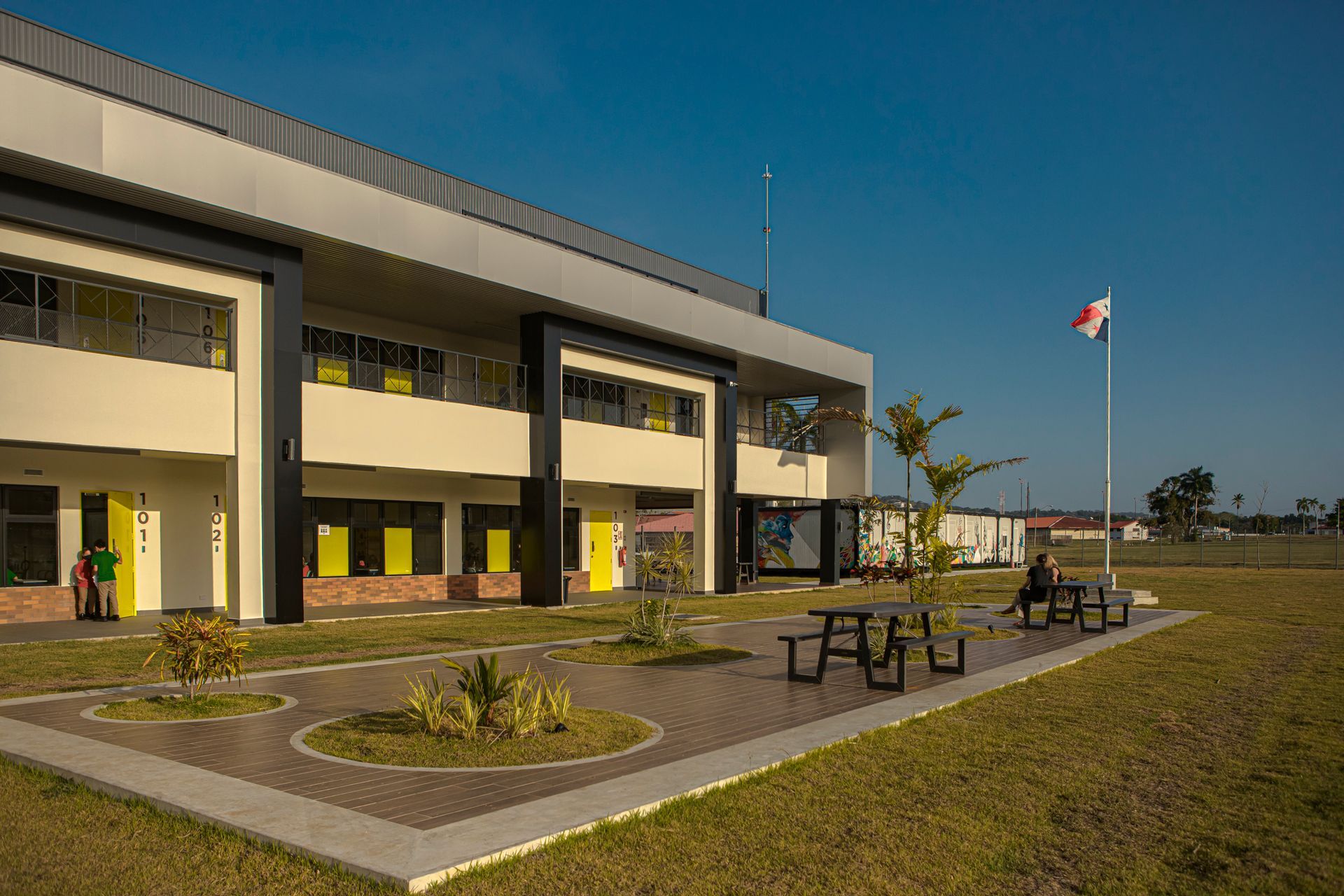 Modern academic building exterior with outdoor seating and contemporary architecture at Howard Academy.