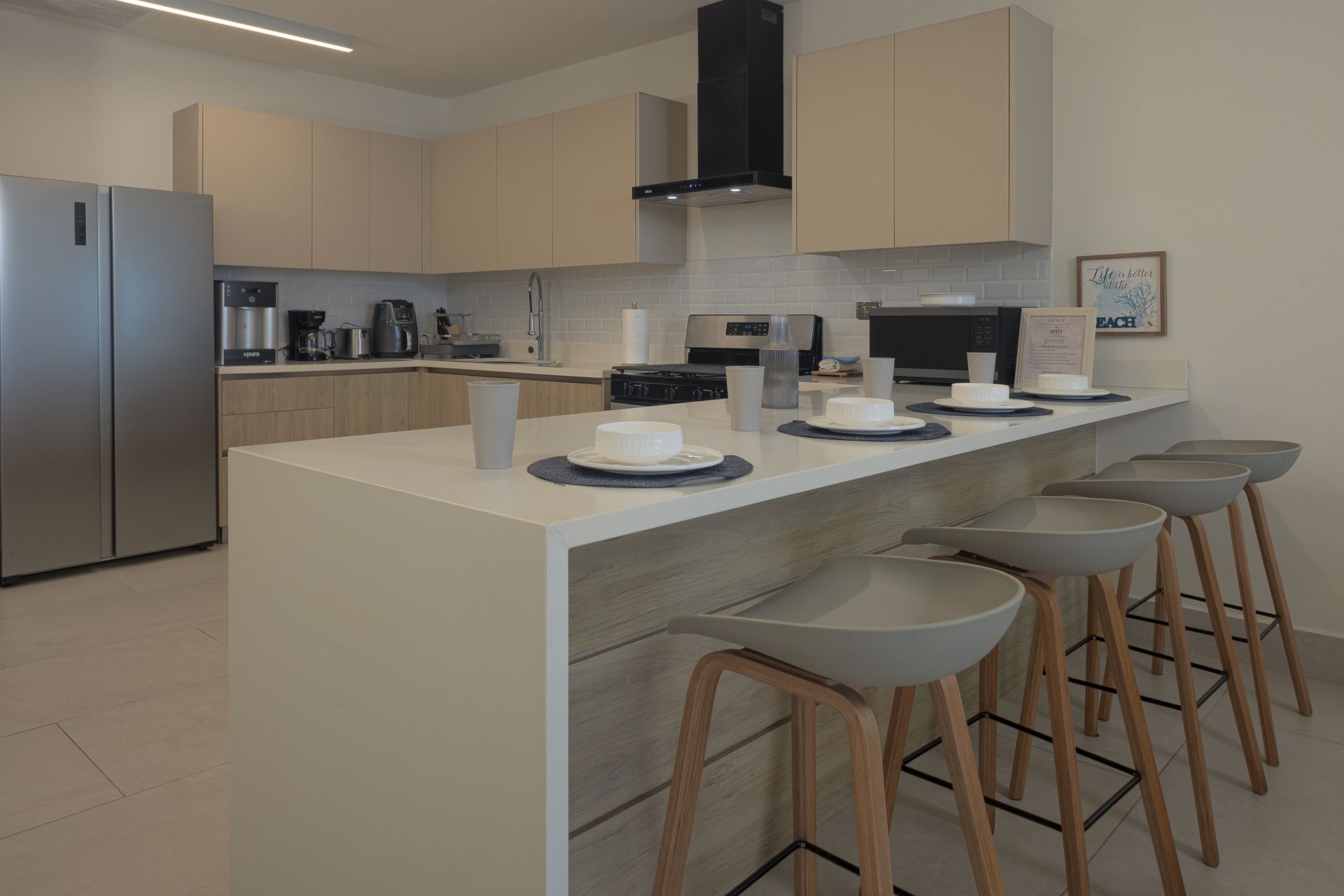 Playa Escondida | Amazinn Places Kitchen and living area at this Amazinn Places vacation rental in Playa Escondida, Colón