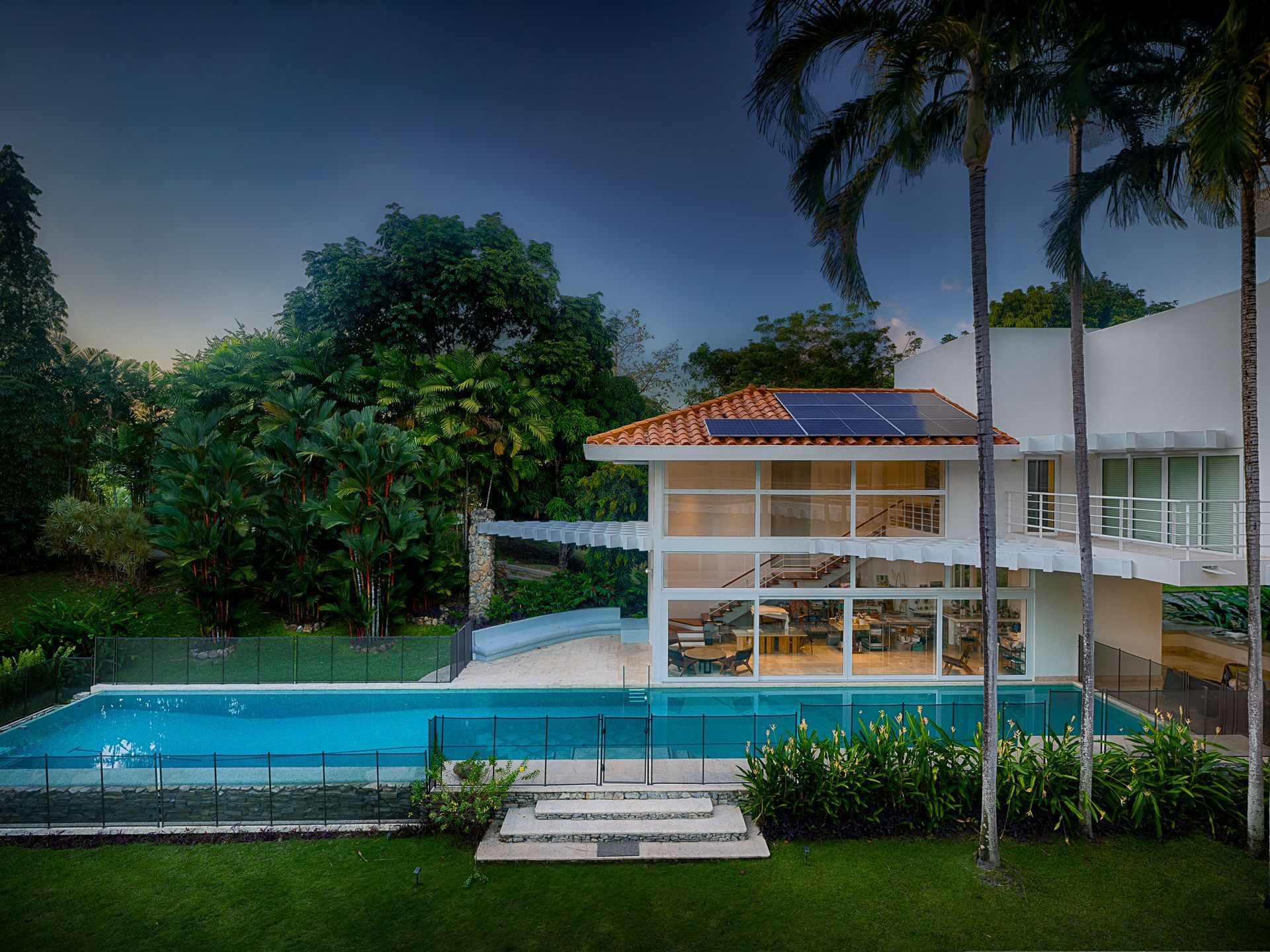 Twilight architectural photography of a luxury mansion in Punta Barco.