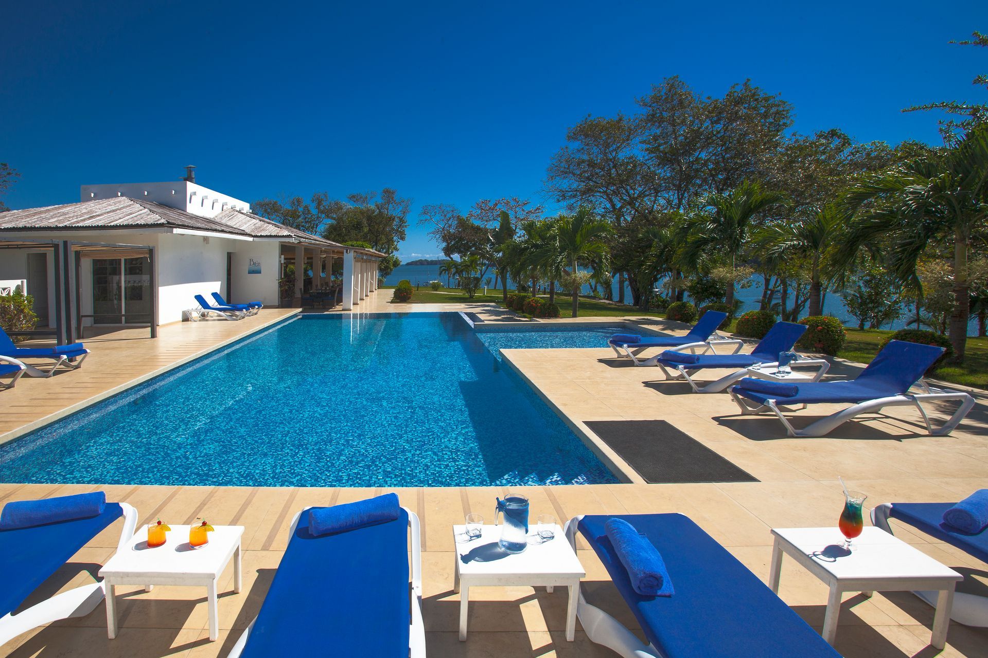 Infinity pool with ocean views and lounge chairs at Hotel Bocas del Mar in Boca Chica, Chiriquí, Panama.