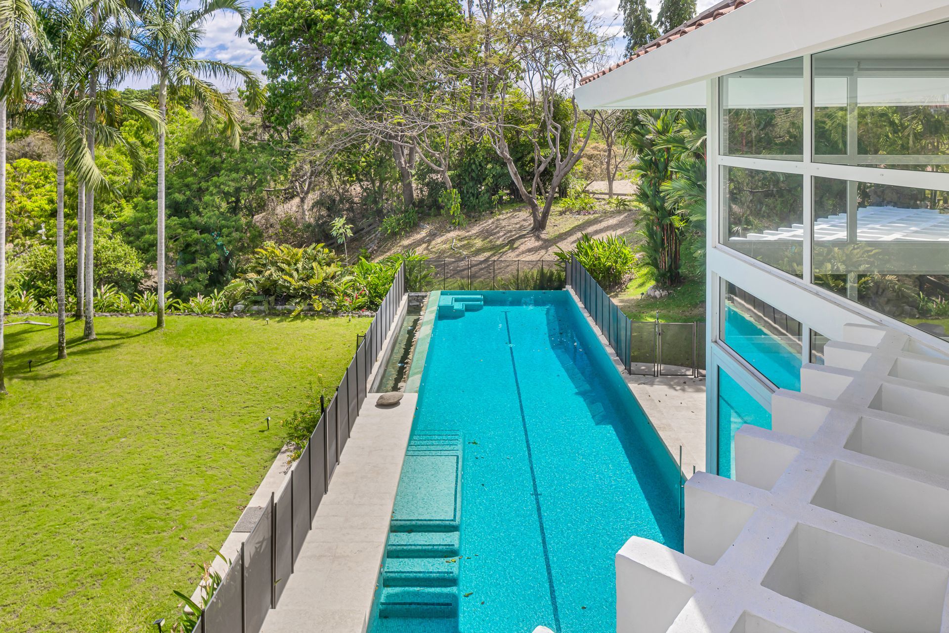 Modern lap pool architectural photography at Punta Barco Resort.