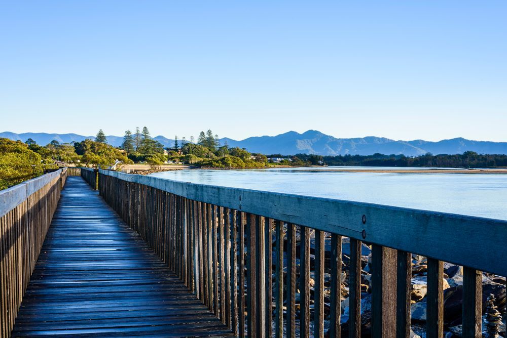 Landscape Of Urunga Lagoon With Boardwalk — Coffs Coast Designer Bathrooms in Urunga, NSW