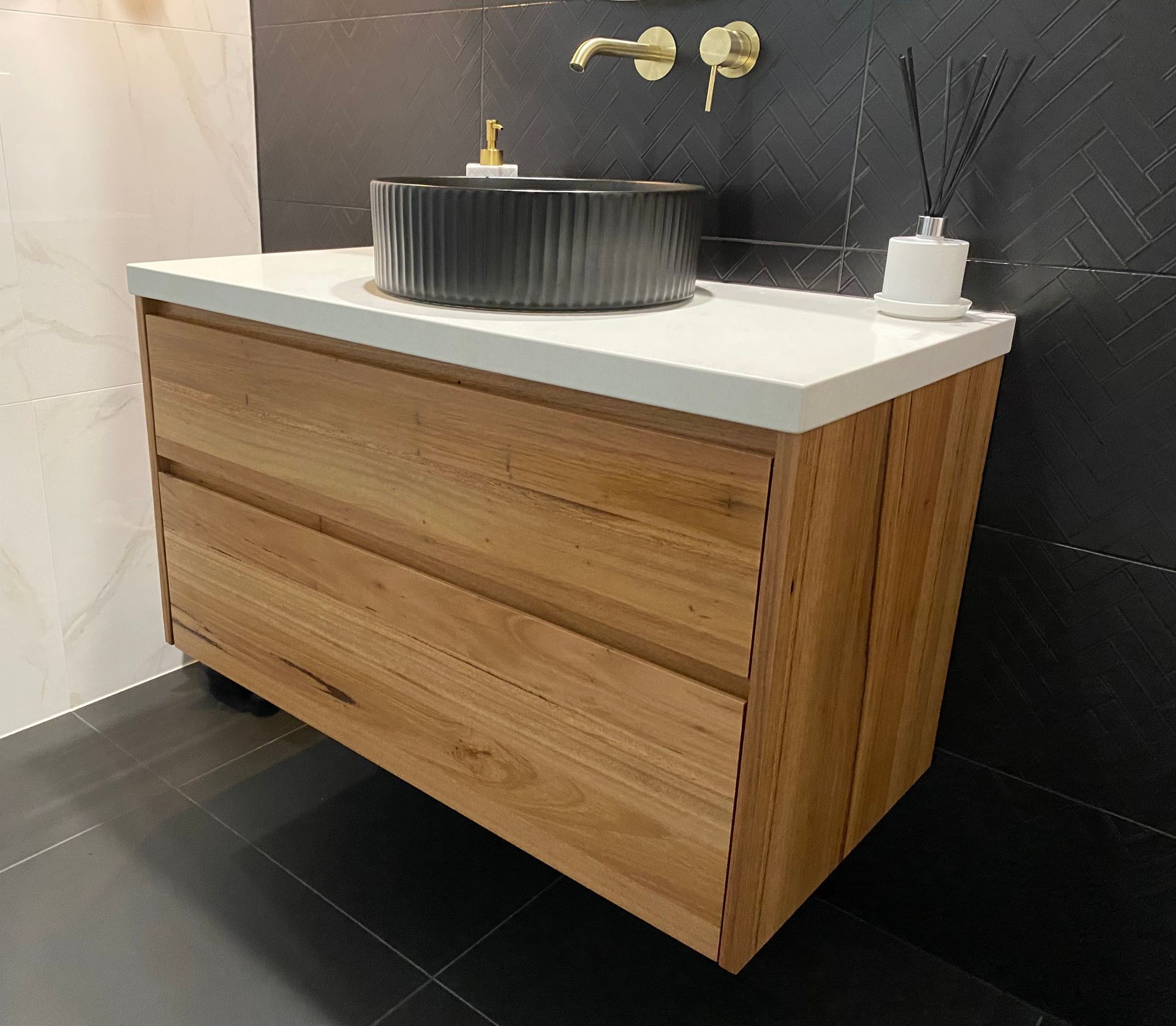 A Bathroom With A Wooden Vanity And A Black Sink — Coffs Coast Designer Bathrooms in Toormina, NSW