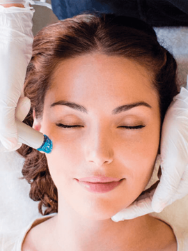 Woman getting a Hydrafacial in an Aesthetics Clinic