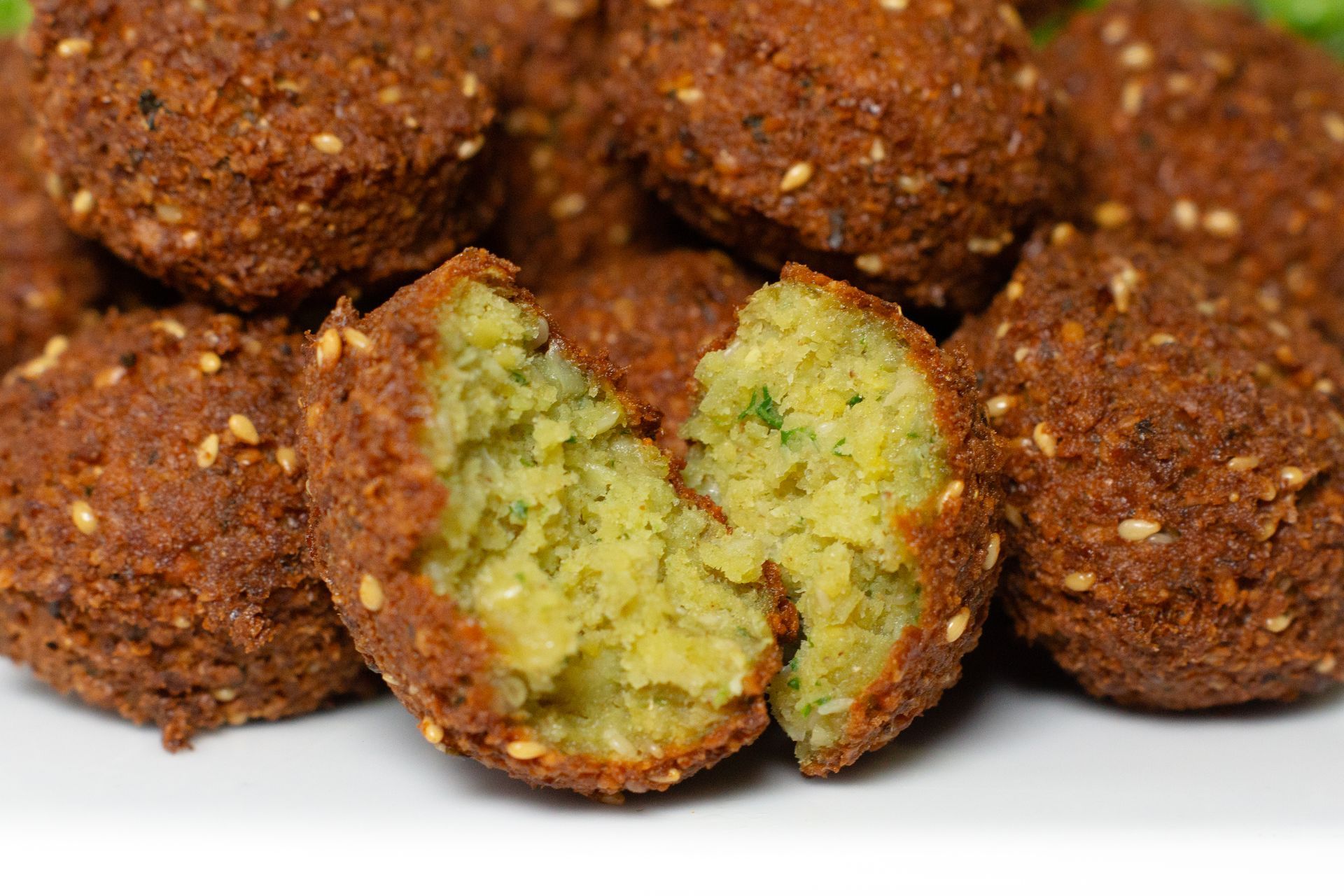 Falafel:Fried spiced , seasame seed ground chickpeas with onions garlic parsley cilantro