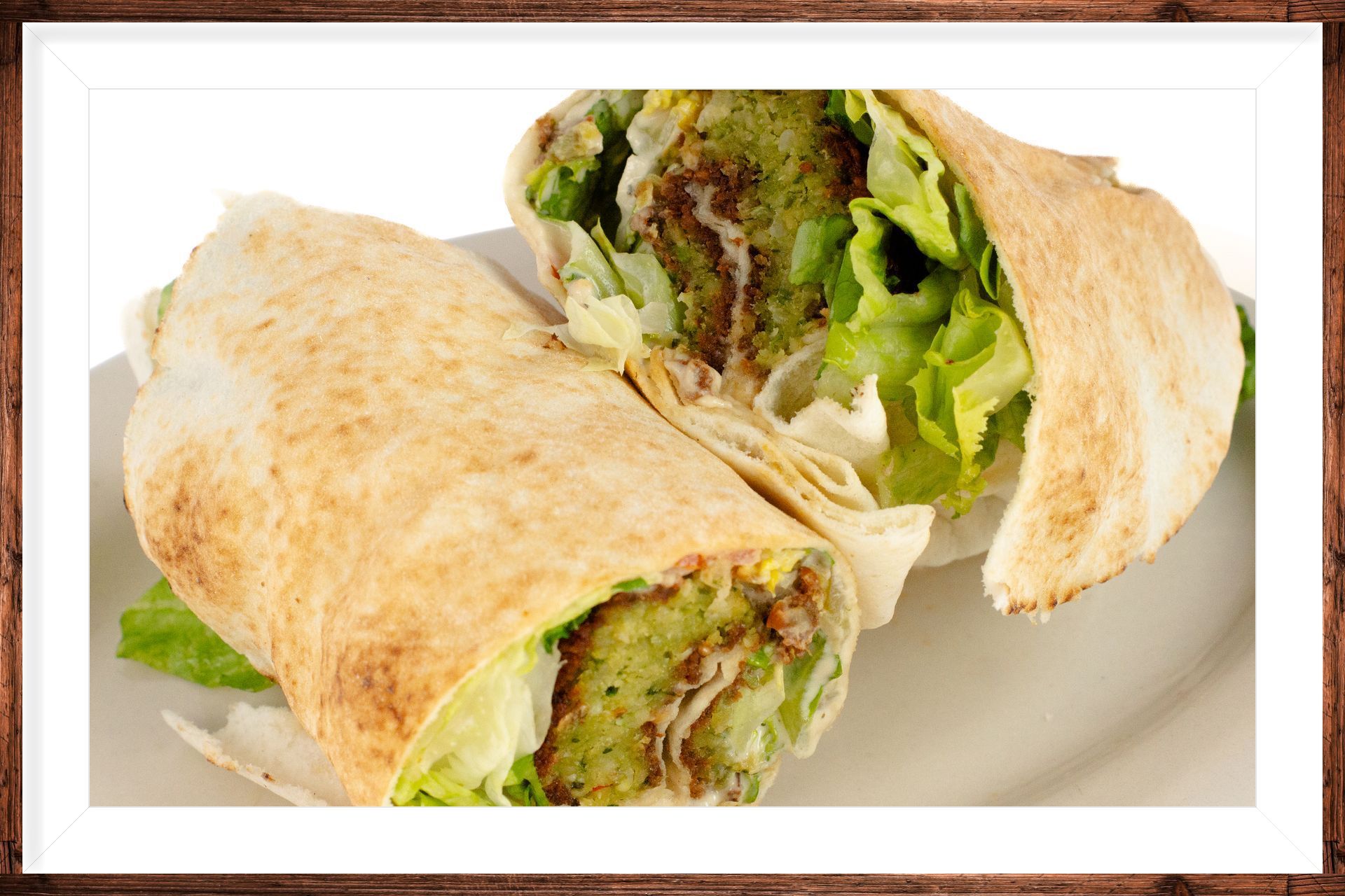 Falafel Sandwich: Pickles Tahini Hummus tomatoes Lettuce Falafel فلافل فلفل