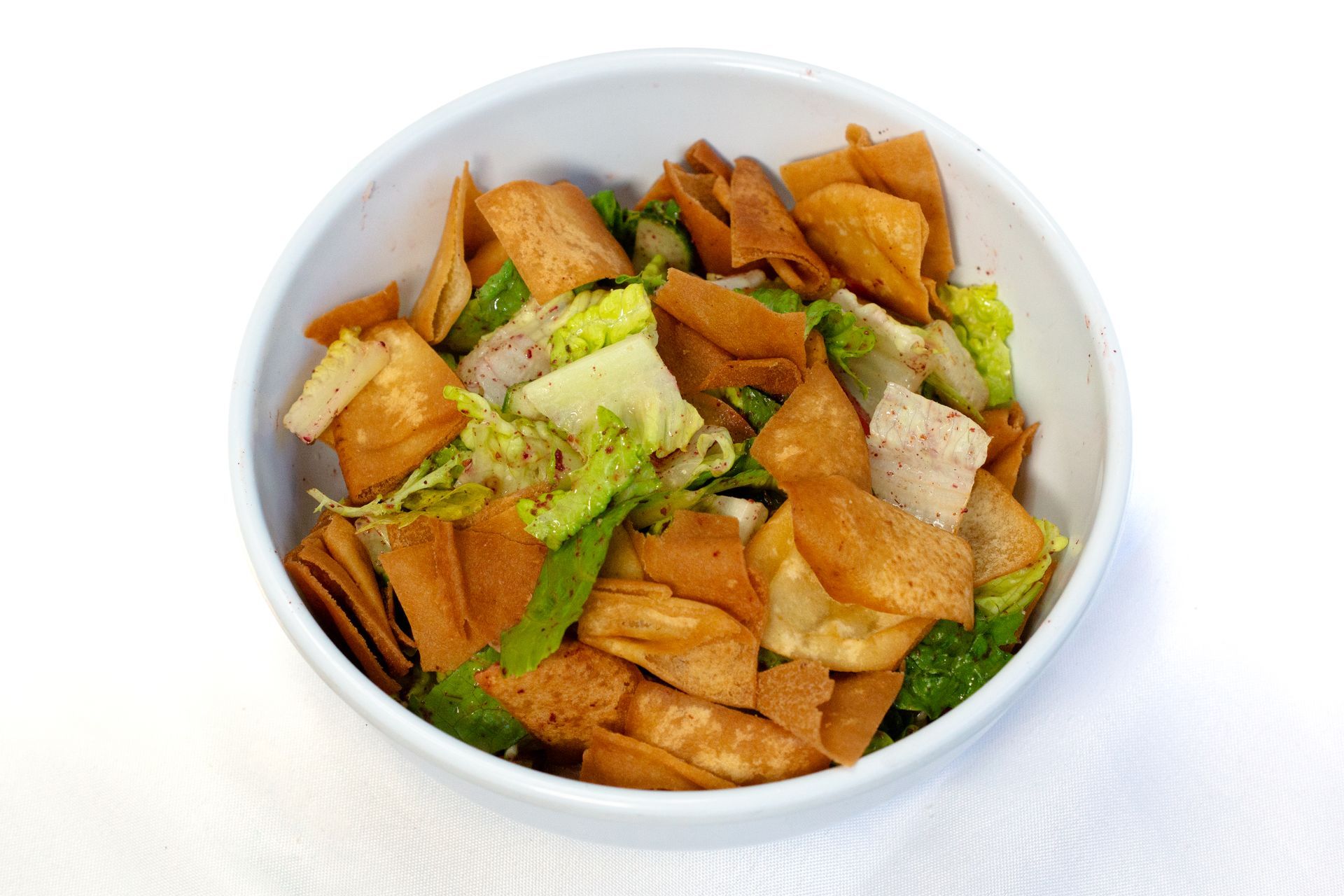 Fattoush Salad : Lettuce tomato cucumber fried pita on top olive oil lemon dressing فتوش