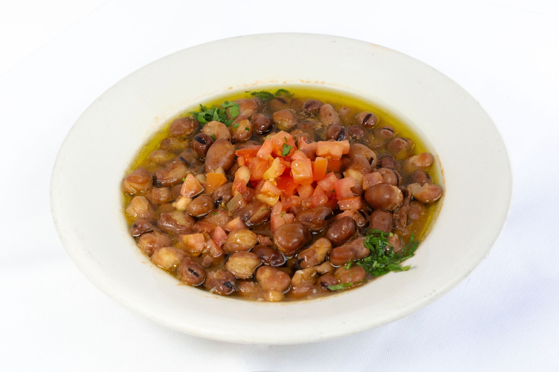 Foul Dip: Fava beans topped w tomato olive oil الفول