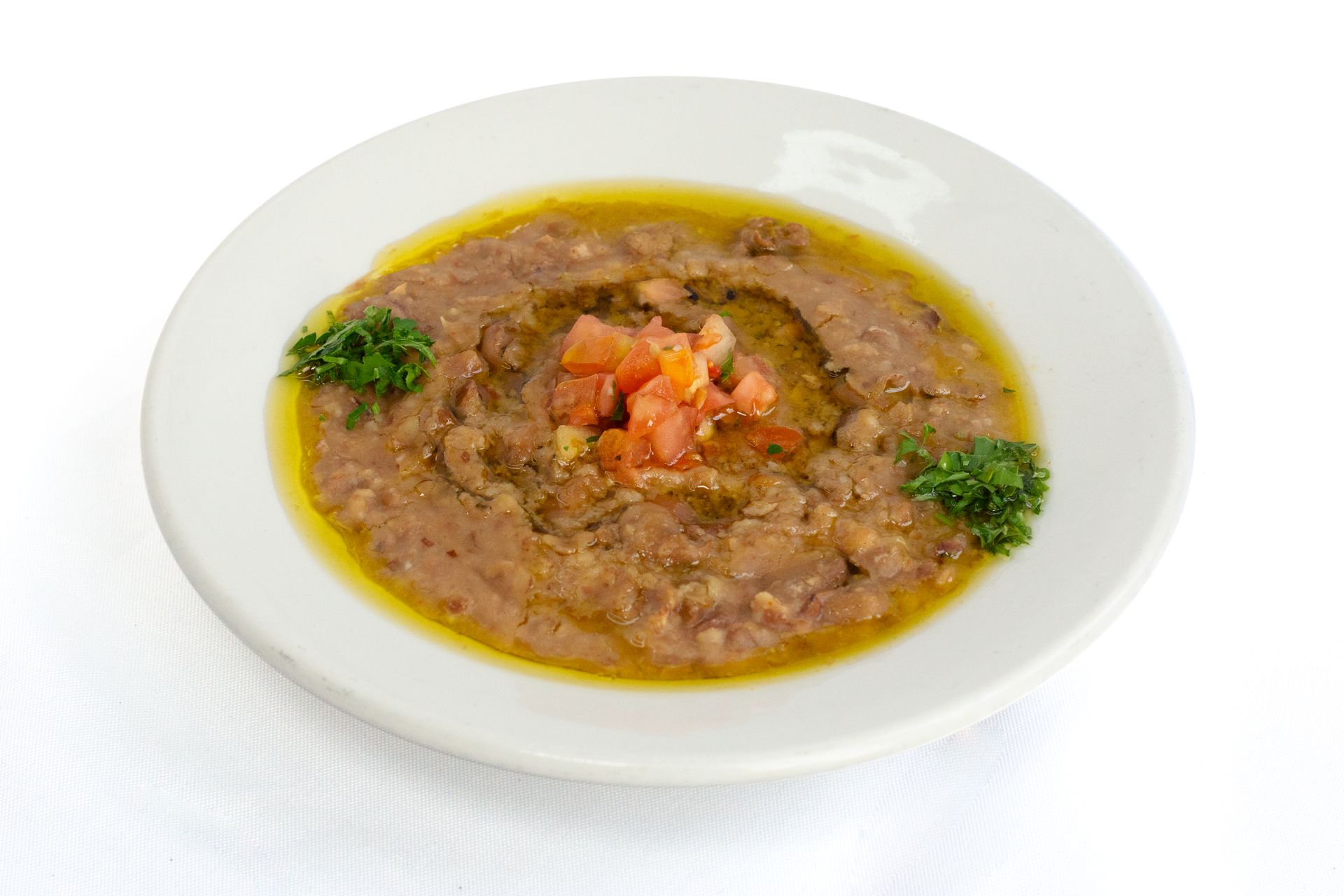 Foul Medames : Minced fava beans topped w tomato garlic olive oil Foul medames فول مدمس.