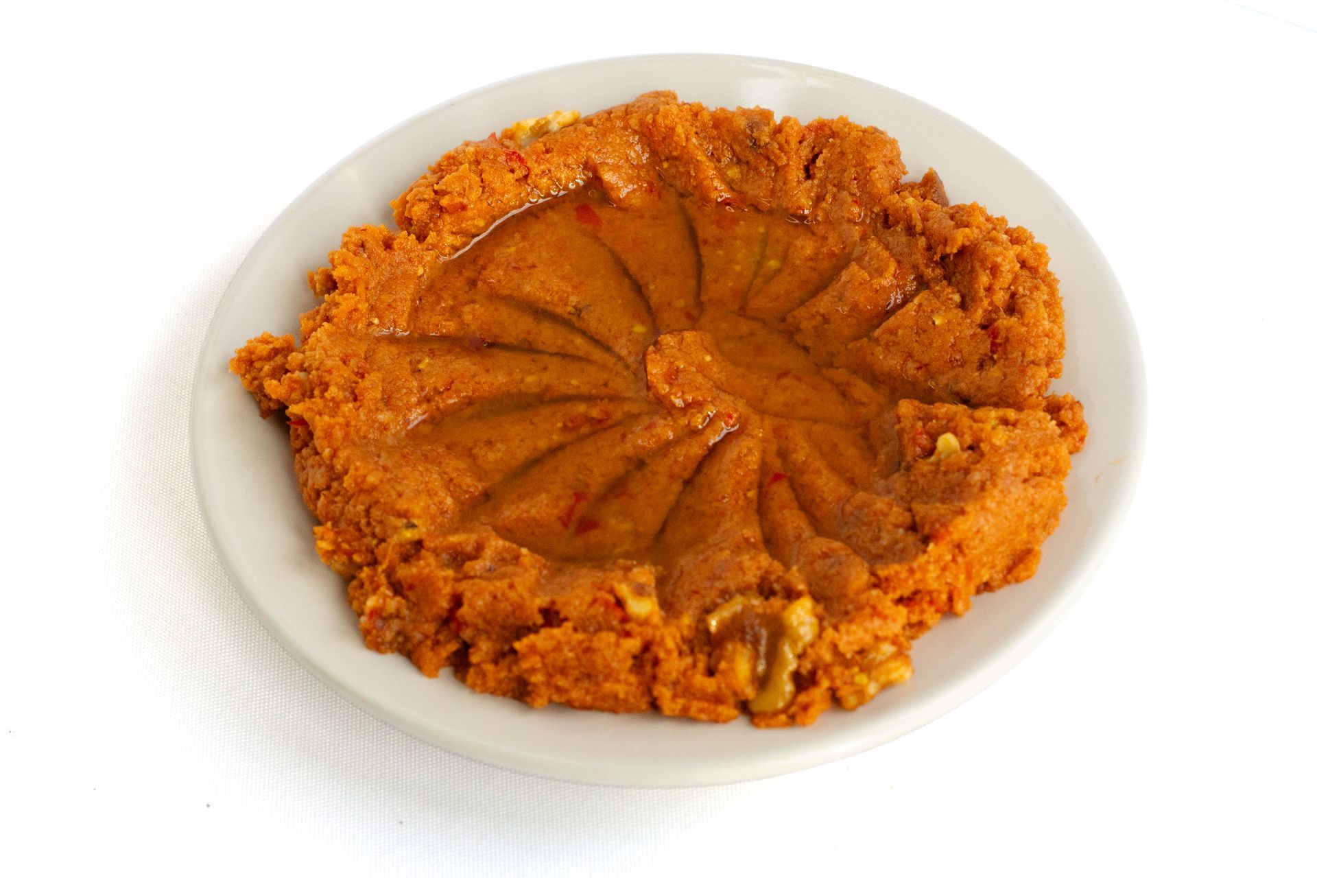 Muhammara:Walnut , pistachios tomato sweet pepper onion pomegranate molasses mixed with bread and olive oil محمرة , Muhammara