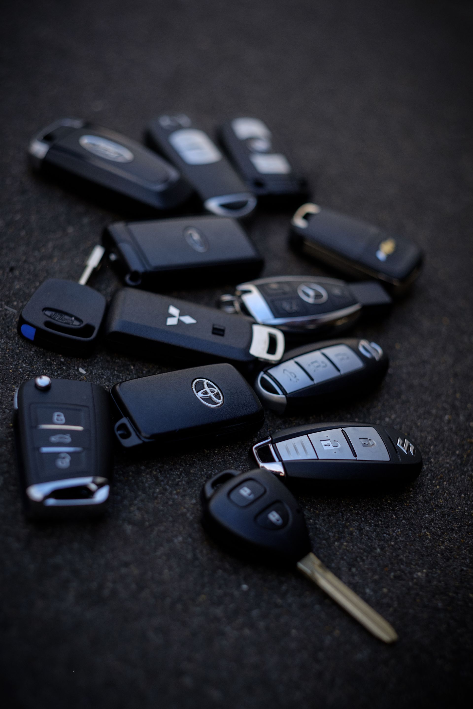 A car key is plugged into the ignition of a car.