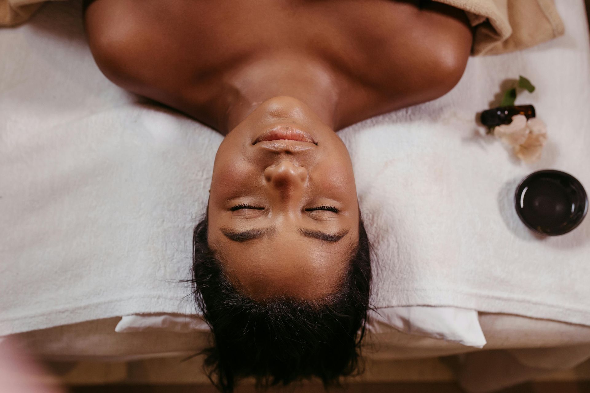 A patient laying down ready to get a Mermaid Facial.