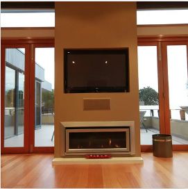A fireplace with a flat screen tv above it | House Building Services | Clifton Springs