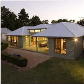A house with a white roof and a lot of windows | House Building Services | Clifton Springs