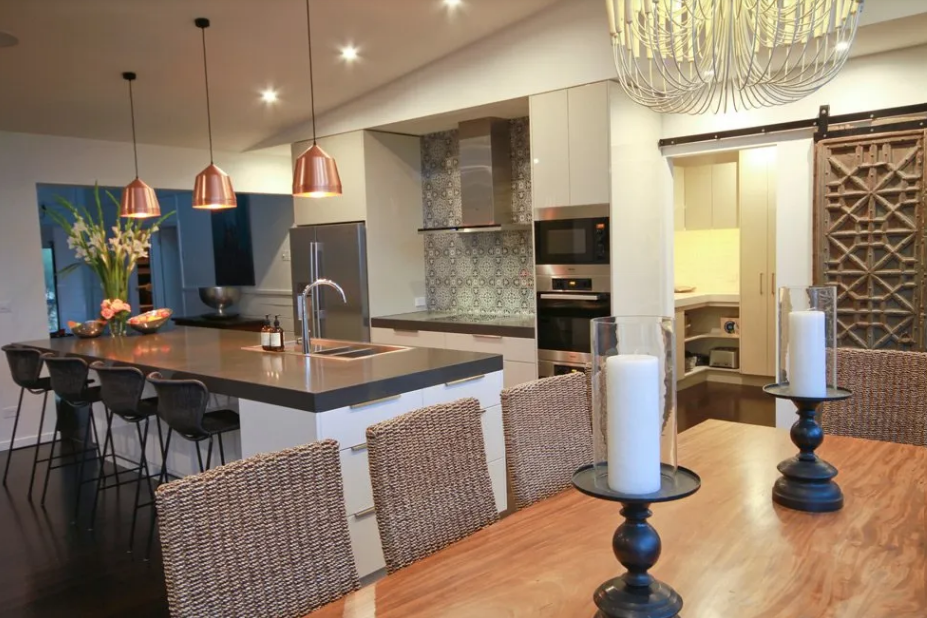 A dining room table with candles on it in a kitchen | House Building Services | Clifton Springs
