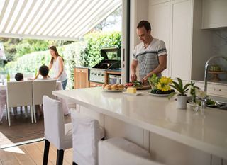 A family preparing to eat on their home  | Building Services | Coastyle