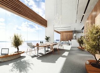 A living room with a large table and chairs and a view of the ocean  | Building Services | Coastyle