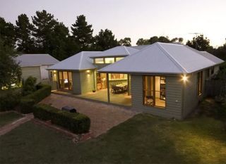 A house with a white roof and a lot of windows  | Building Services | Coastyle