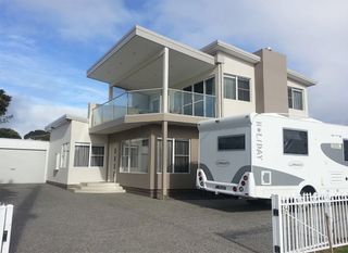 A large house with a rv parked in front of it | House Building Services