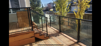 a backyard with a pergola and a hot tub