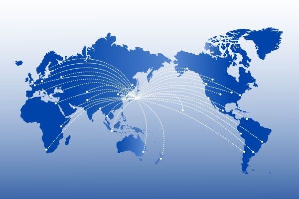 Blue world map with white lines radiating from Japan, indicating global connections.