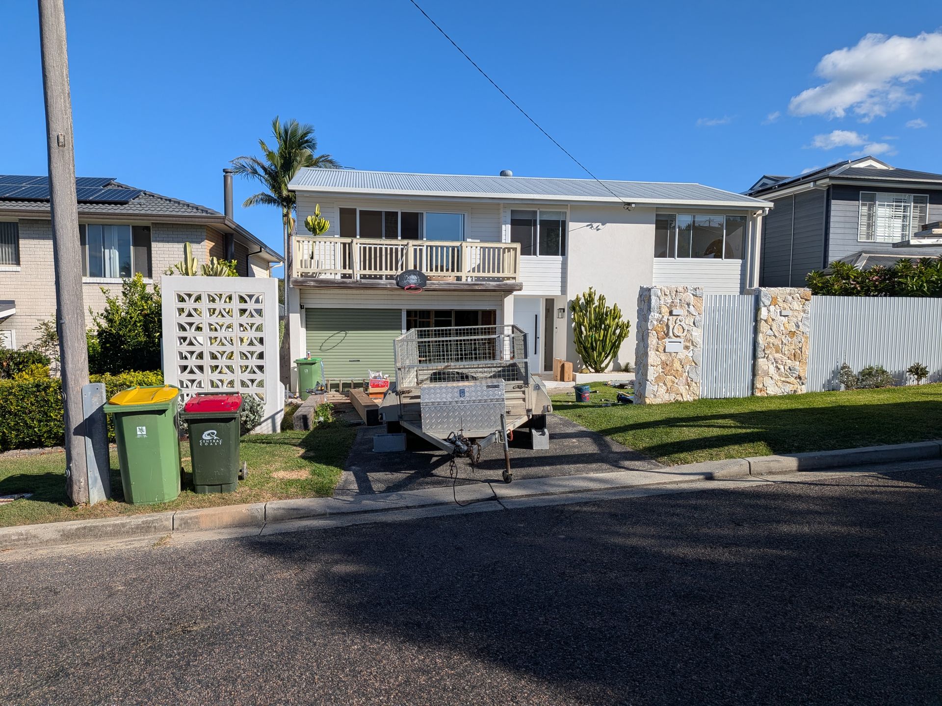Street-side View of a Two-story House With Scattered Debris — Lakecrest Projects in Lake Macquarie, NSW