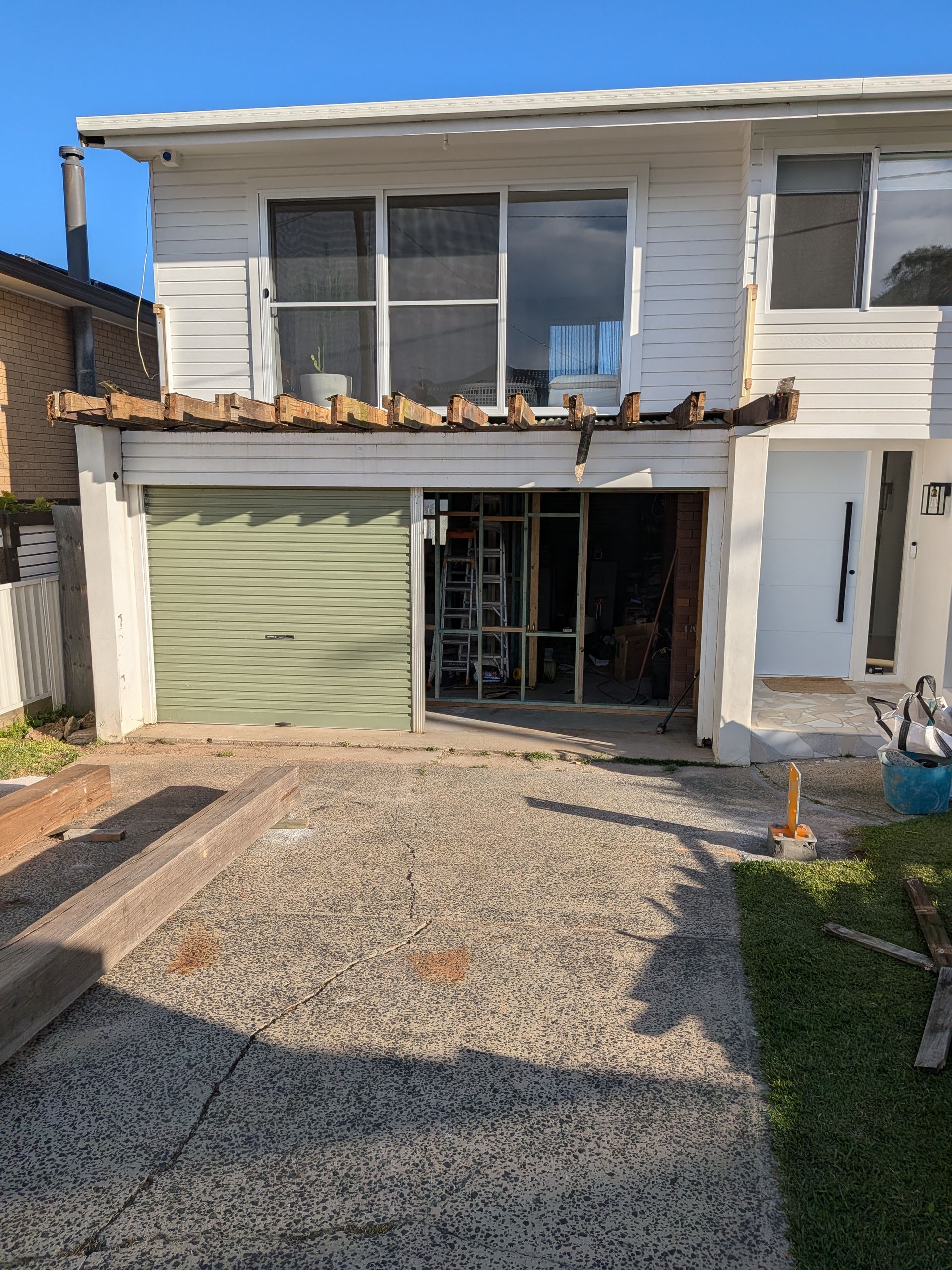 Damaged Two-story House With Partially Demolished Front Wall — Lakecrest Projects in Belmont North, NSW