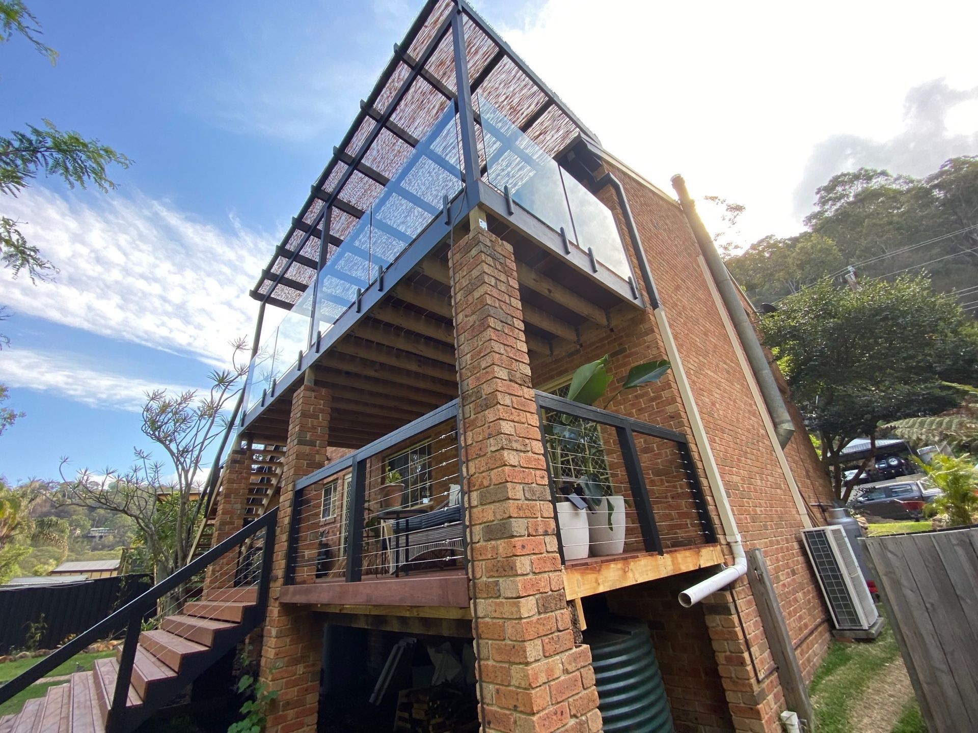 Modern Brick House With a Glass Upper Floor and Stairs — Lakecrest Projects in Belmont North, NSW