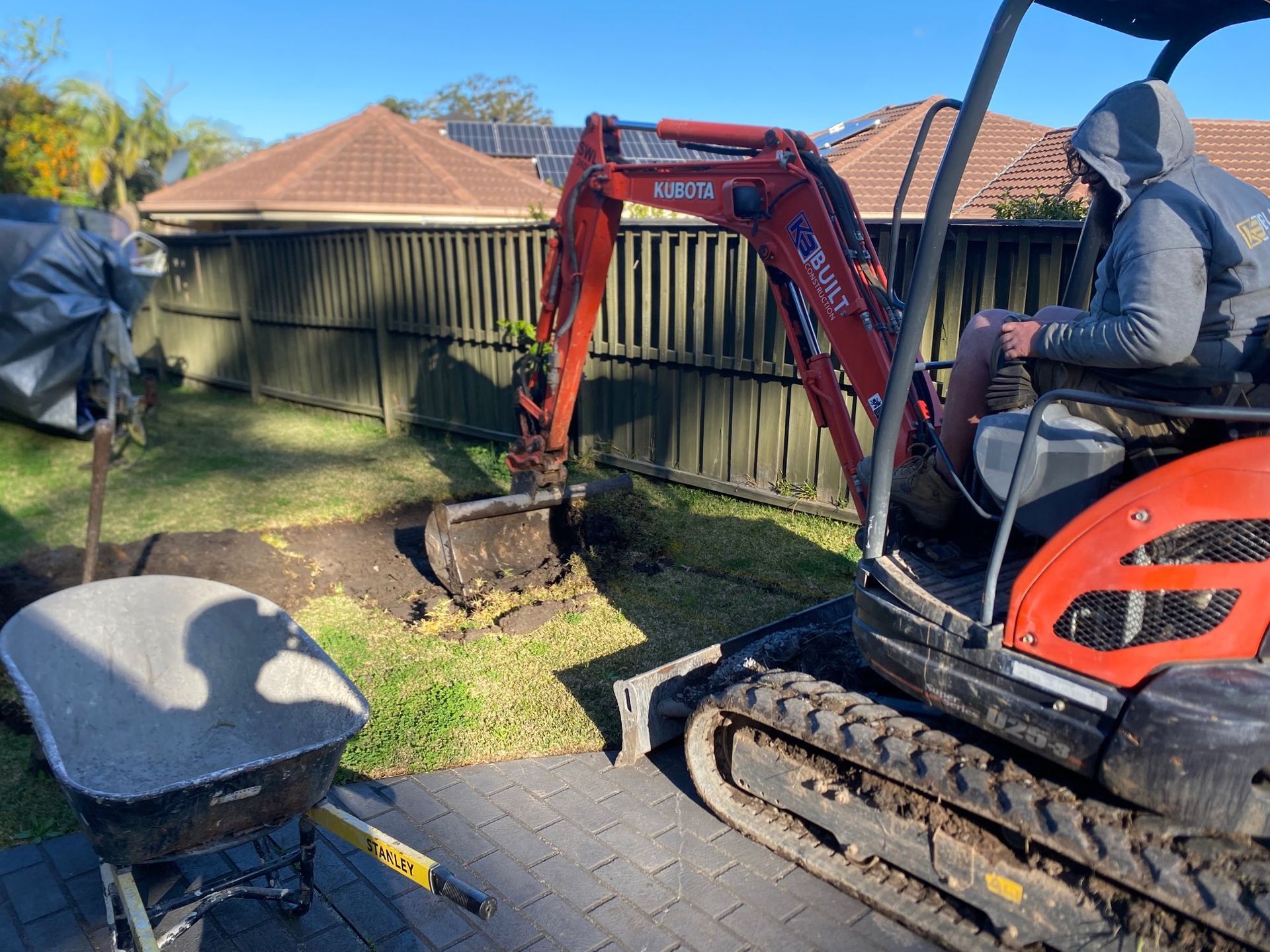 Mini Excavator Digging in a Backyard — Lakecrest Projects in Belmont North, NSW