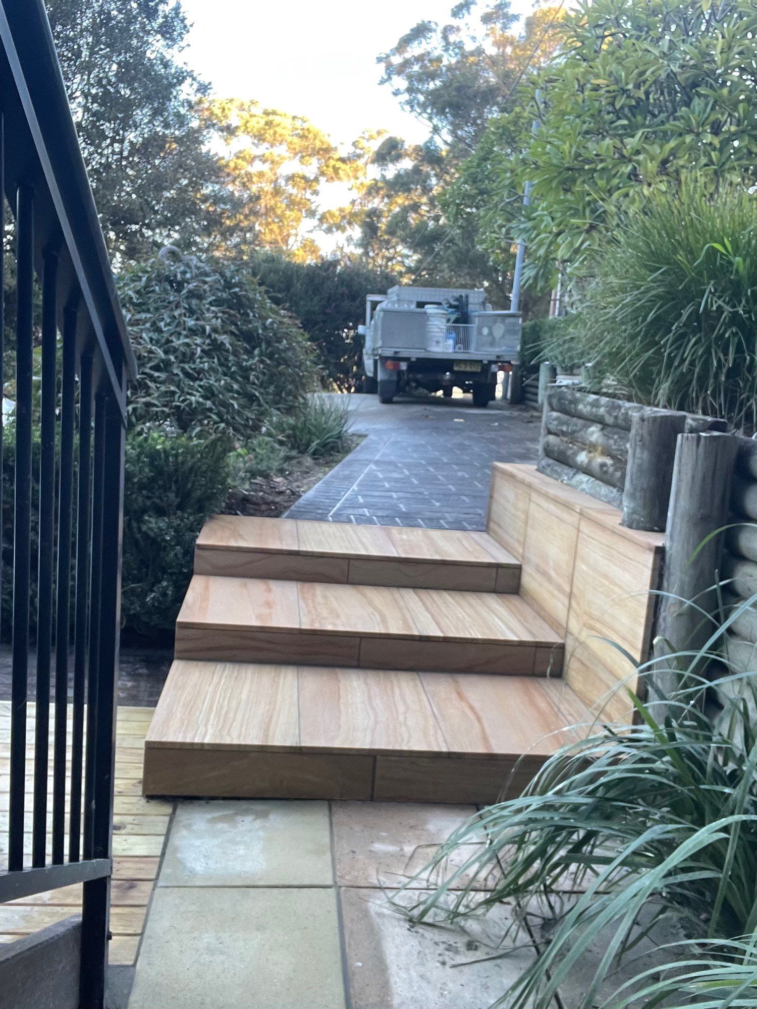 Wooden Steps Leading to a Driveway With a Parked Truck — Lakecrest Projects in Belmont North, NSW