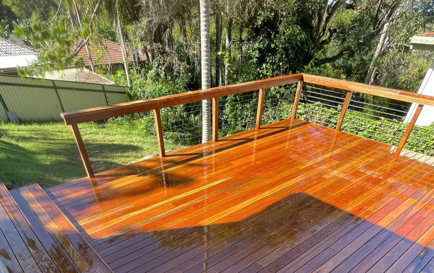 Wooden Staircase With Railing Leading Down to a Grassy Yard — Lakecrest Projects in Belmont North, NSW