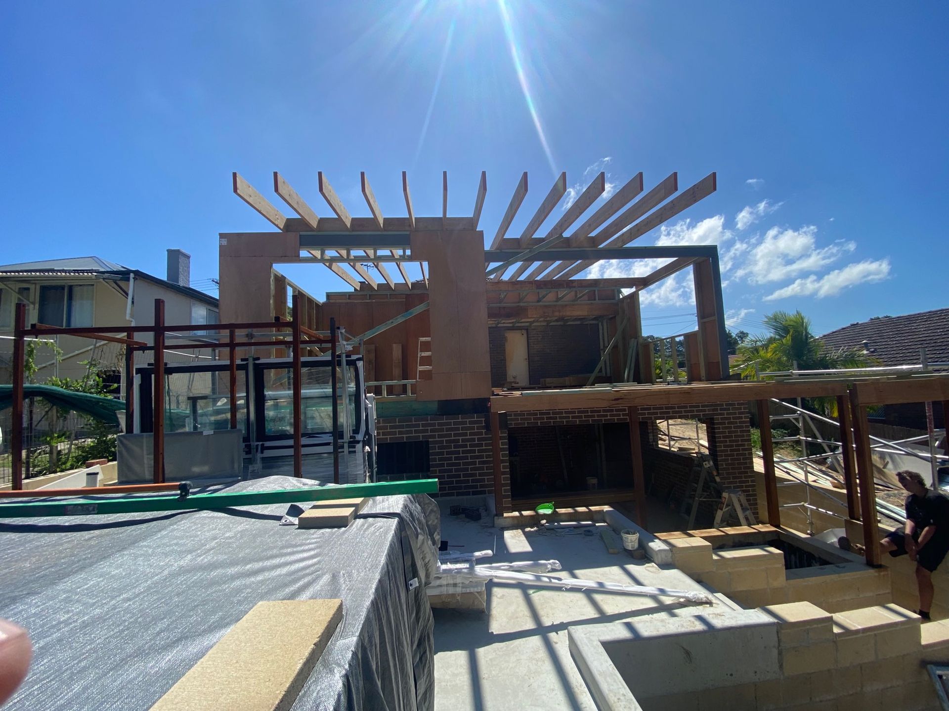 Construction Site With Wooden Pergola Framework — Lakecrest Projects in Belmont North, NSW