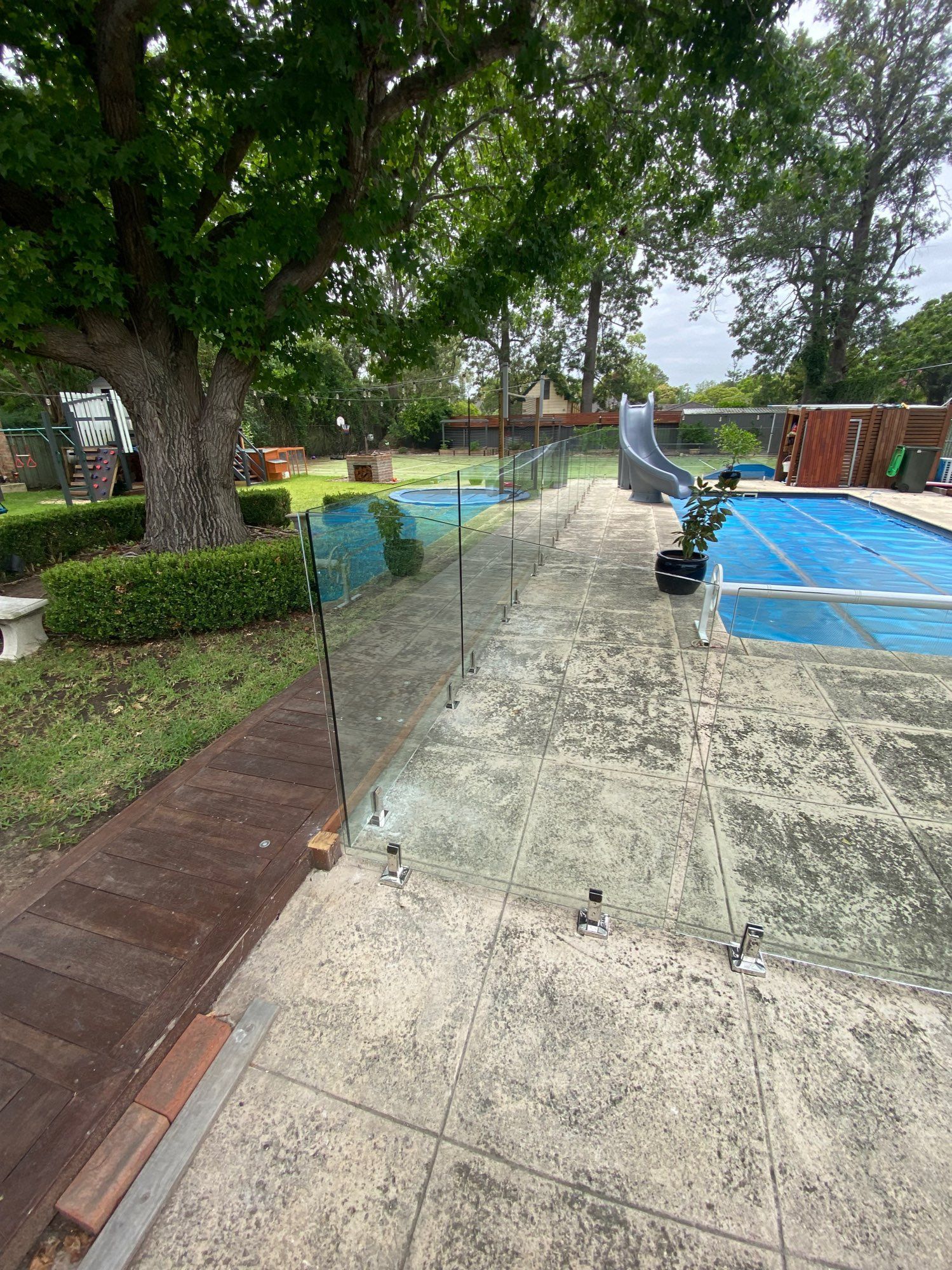 Wet Patio With Blue-covered Pool — Lakecrest Projects in Belmont North, NSW