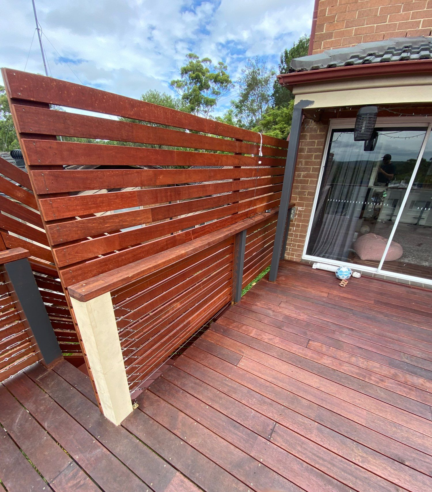 Wooden Slat Privacy Screen on a Deck Beside a Brick House — Lakecrest Projects in Belmont North, NSW