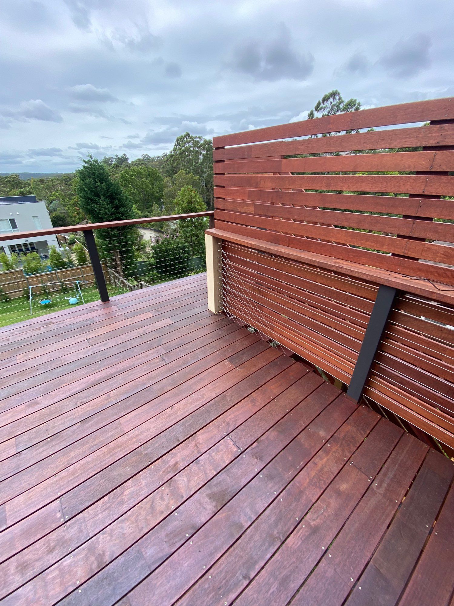 Wooden Rooftop Deck With Red-brown Slat Railing — Lakecrest Projects in Belmont North, NSW