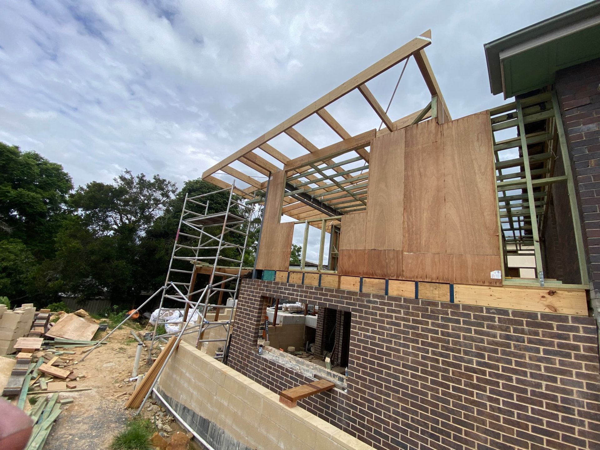 House Under Construction With Brick Wall — Lakecrest Projects in Lake Macquarie, NSW