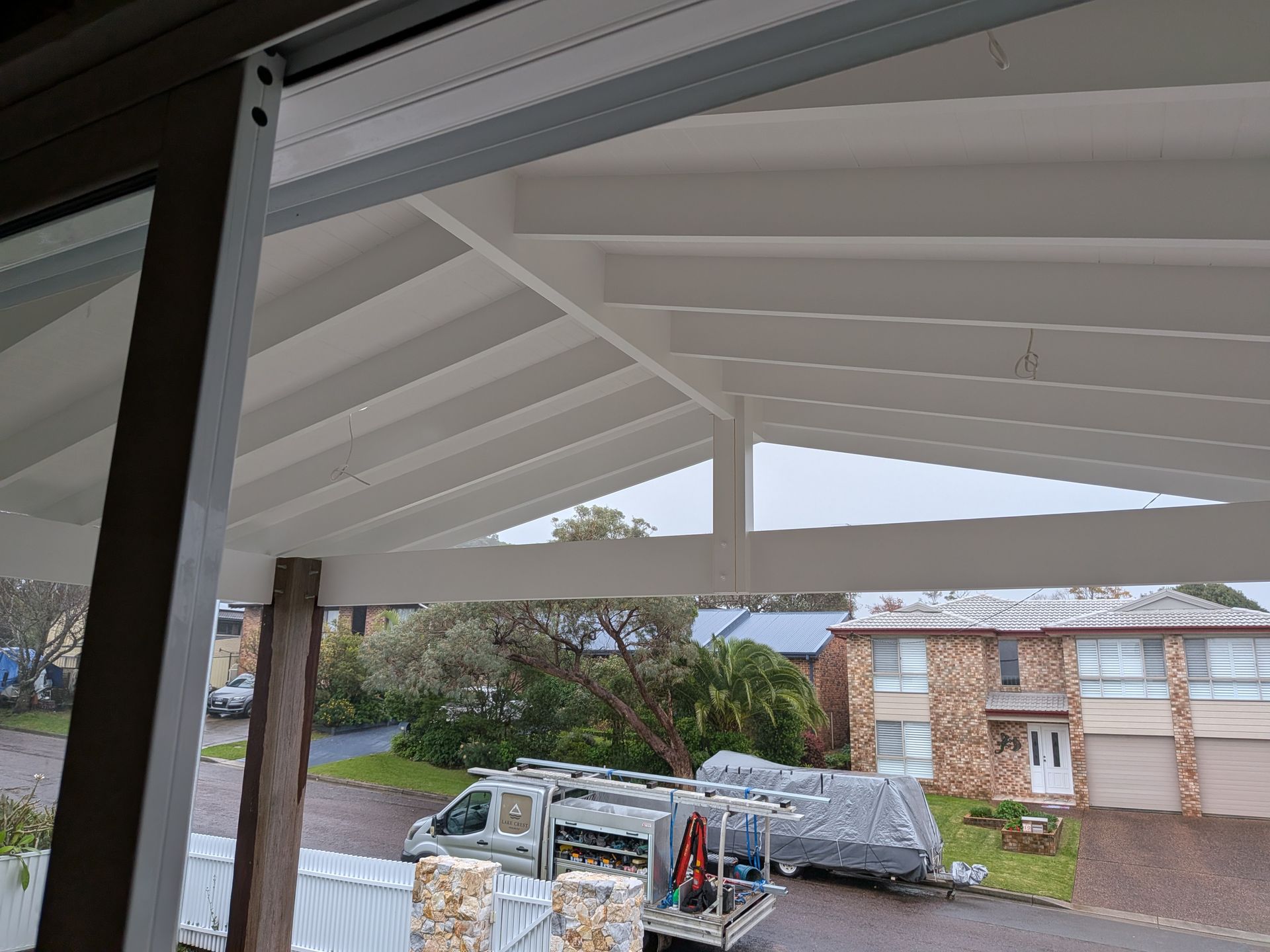 View From a Porch Toward a Driveway With a Pickup Truck — Lakecrest Projects in Belmont North, NSW