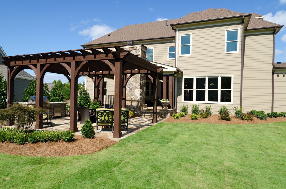 A Large House With a Pergola in the Backyard — Lakecrest Projects in Belmont North, NSW