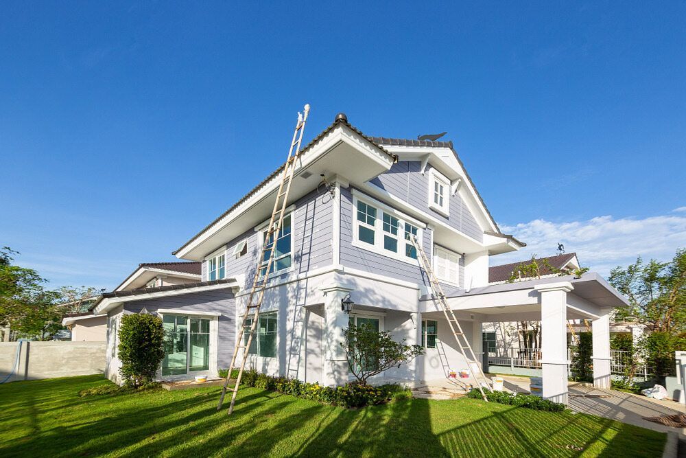 A Large White House is Being Painted With a Ladder — Lakecrest Projects in Hunter Valley, NSW