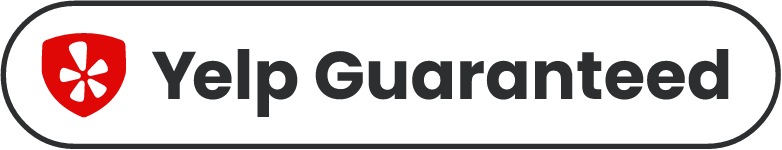 Yelp Guaranteed badge with red shield icon and black text on white background
