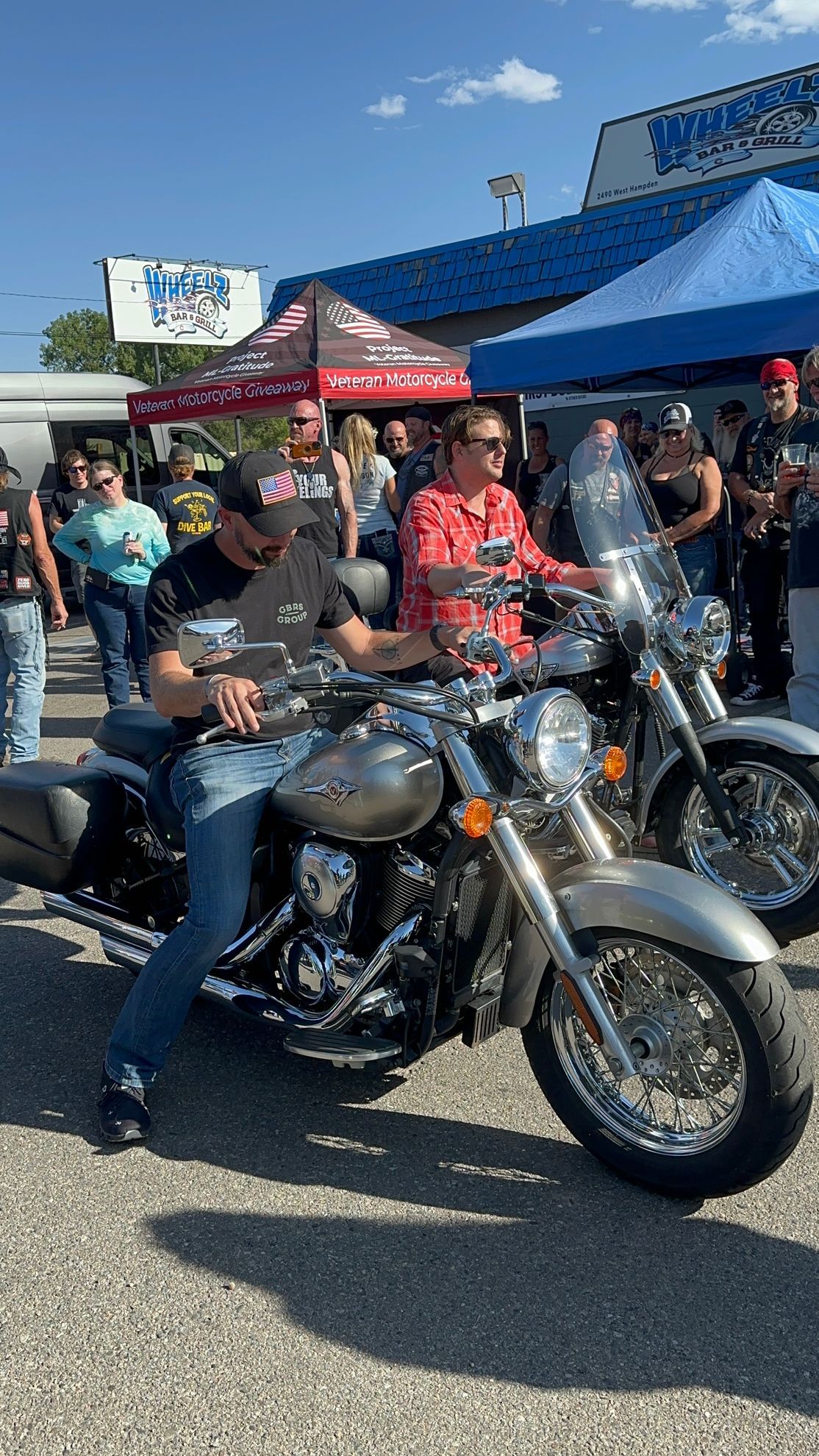 A group of people are riding motorcycles on a street.