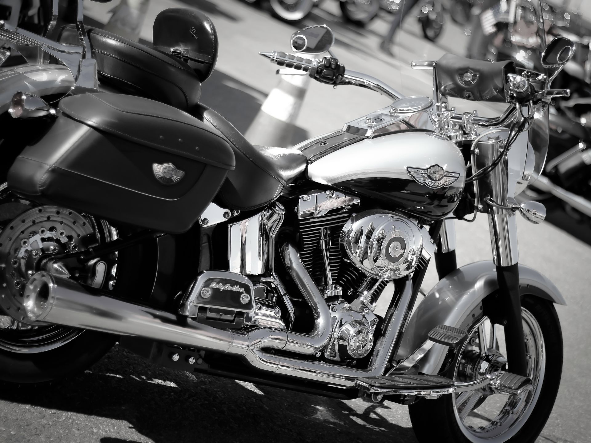 A black and white photo of a harley davidson motorcycle
