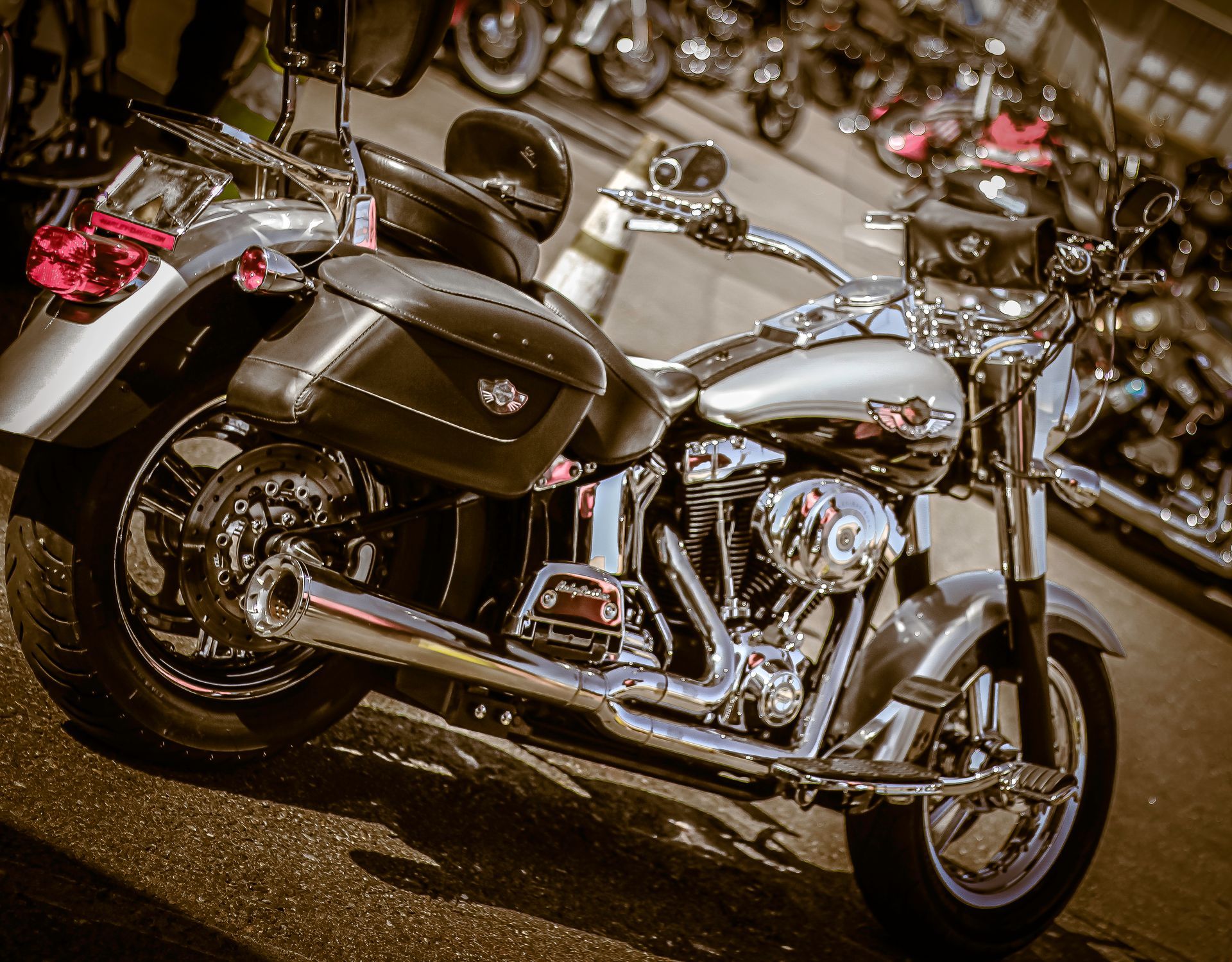 A harley davidson motorcycle is parked on the side of the road
