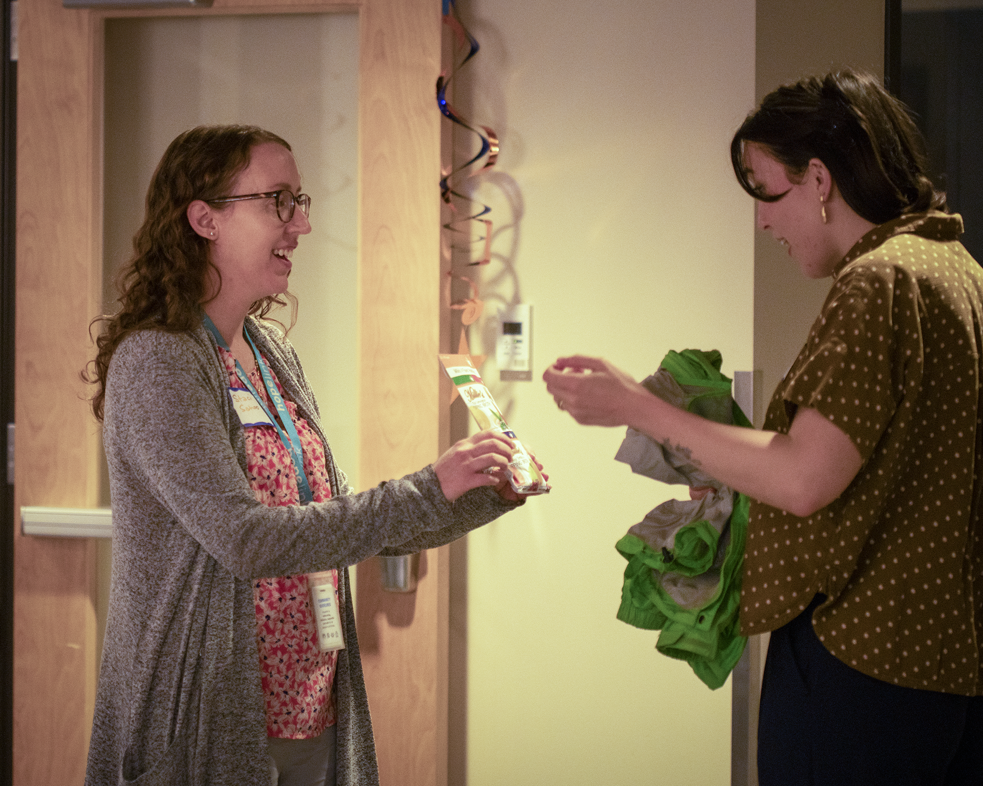 One person gives a gift to another