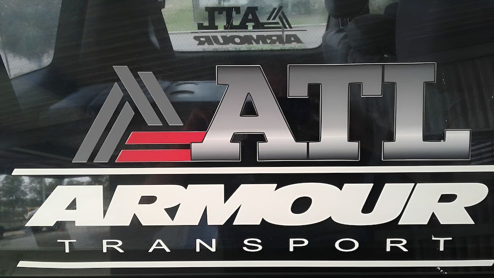 A Logo For A Company Called Armour Transport — Armour Transport Logistics In Maitland, NSW