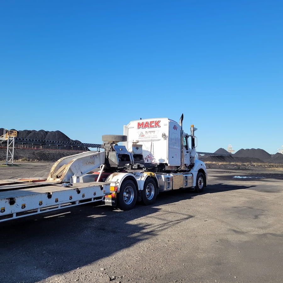 A Mack Semi Truck Is Parked In A Parking Lot — Armour Transport Logistics In Newcastle, NSW