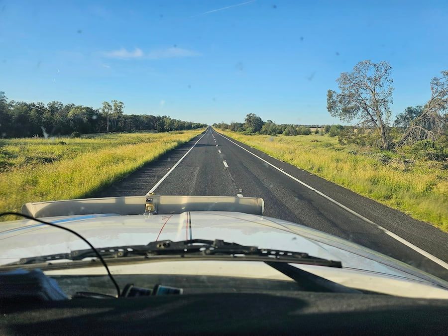 A View Of A Highway From The Driver's Seat Of A Car — Armour Transport Logistics In Mackay, QLD