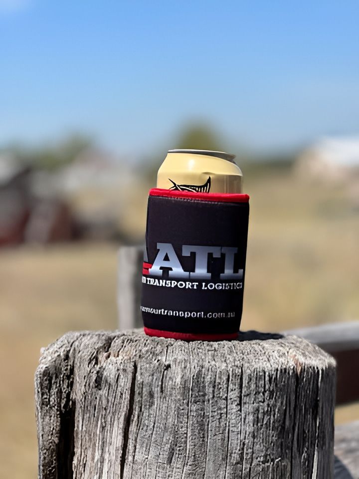 A Can Of Beer Is Sitting On Top Of A Wooden Post — Armour Transport Logistics In Newcastle, NSW
