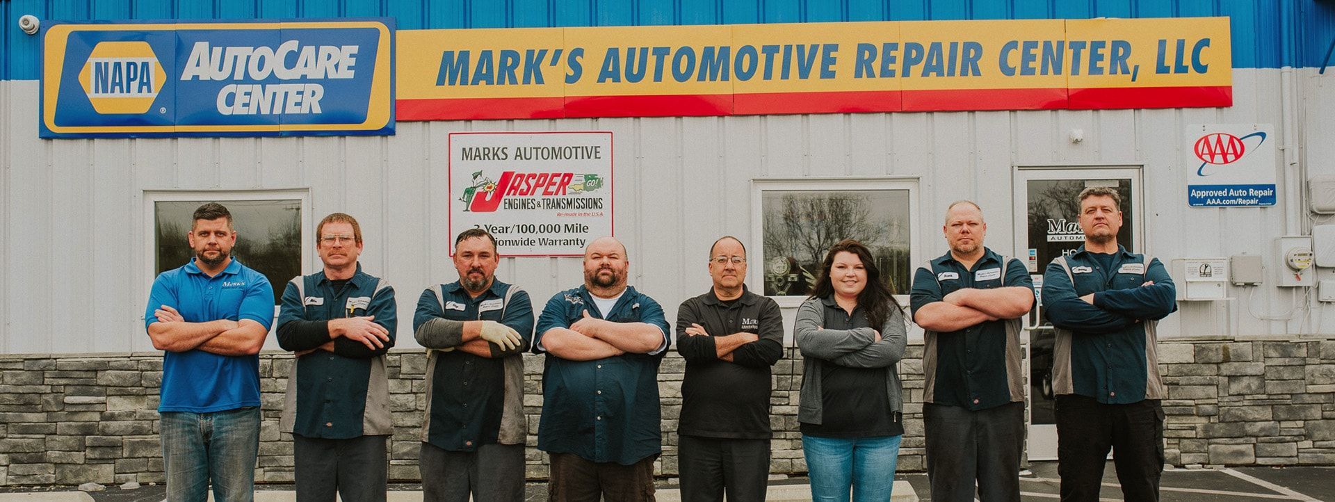Group of people standing outside a business, 