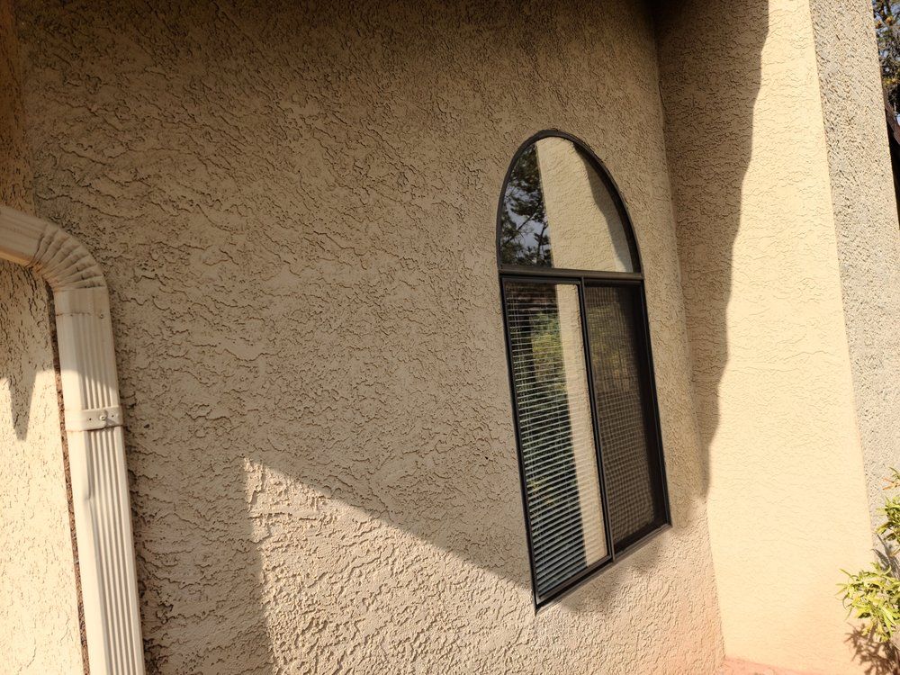A large arched window on the side of a building